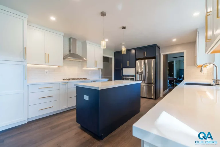 Remodeled Los Altos kitchen with white shaker cabinets and navy island