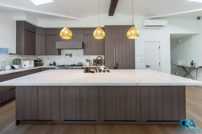 New kitchen with long quartz island in a San Jose home addition