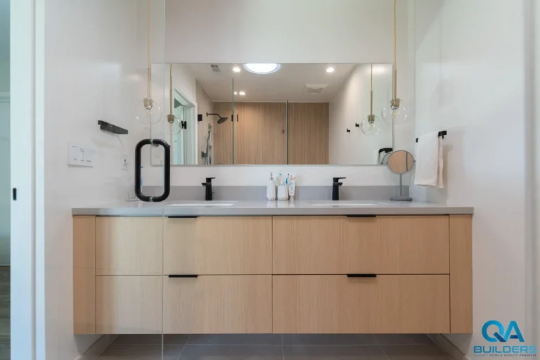 Floating oak double vanity in a remodeled San Jose primary bathroom