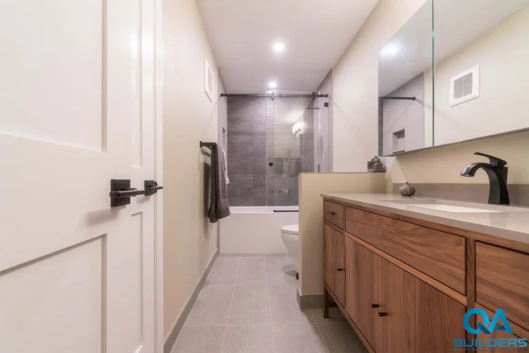 Remodeled Mountain View bathroom with long walnut vanity and tub