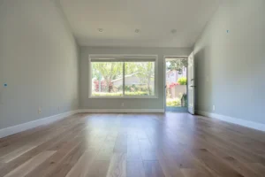 Bright living room with new wood flooring in Cupertino townhouse