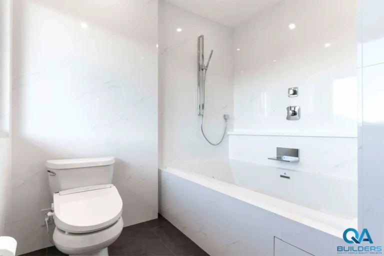 Remodeled Saratoga bathroom with built-in soaking tub and white tile walls
