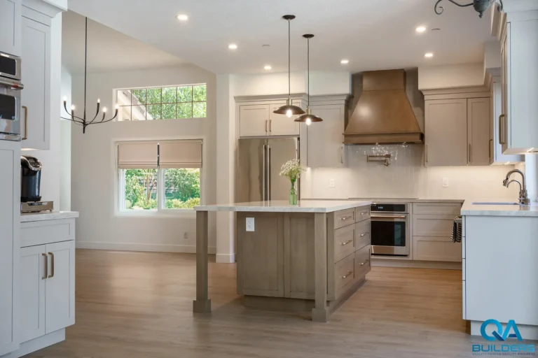 Open kitchen remodel with large island and copper hood in Livermore