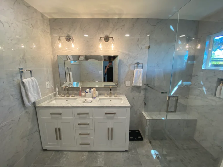 Master bathroom remodel with curbless glass shower and white vanity in Palo Alto