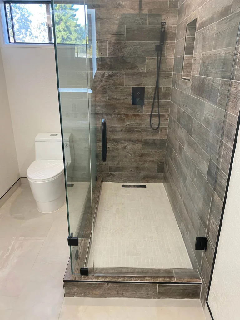 Master bathroom shower with matte black fixtures in Sunnyvale remodel